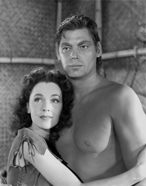 Johnny Weissmuller hugging a Woman while Topless Photo Print - Item # VARCEL709449