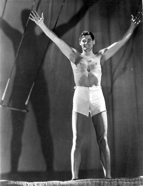 Johnny Weissmuller wearing a White Shorts and Raising His Two Hands Photo Print - Item # VARCEL709461