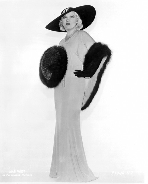 Mae West standing in Elegant Dress with Fur Design in The Center Photo Print - Item # VARCEL709620