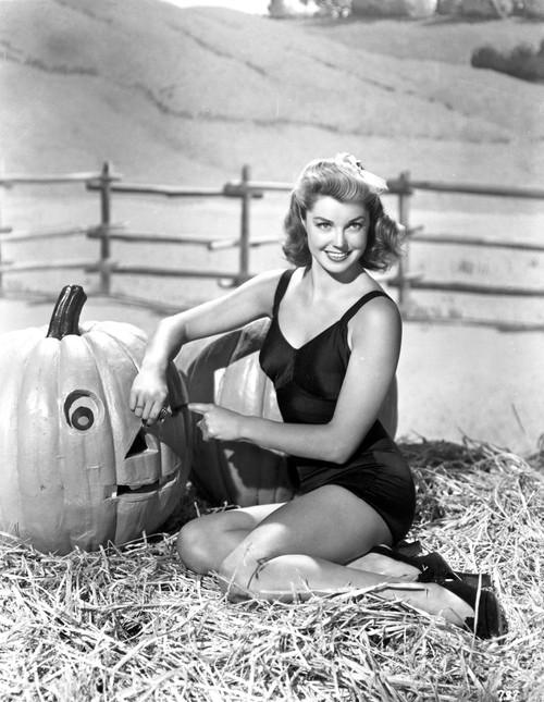 Esther Williams Seated in Hay Photo Print - Item # VARCEL709835