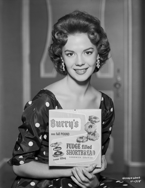 Natalie Wood Holding a Cookbook in Classic Photo Print - Item # VARCEL709971