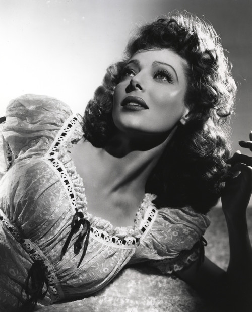 Loretta Young Curly Hair Pose Lying and Wondering Photo Print - Item # VARCEL710077