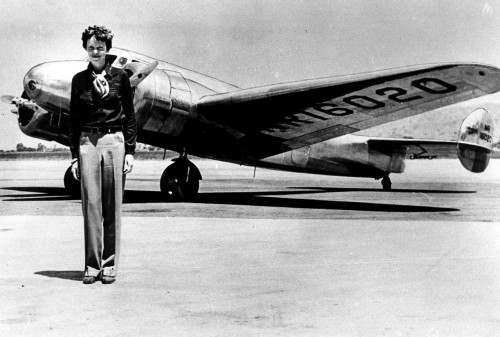 Amelia Earhart by an airplane Photo Print (10 x 8)
