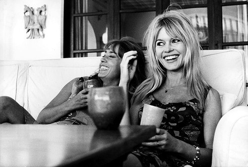 Brigitte Bardot smiling on a sofa Photo Print (10 x 8)