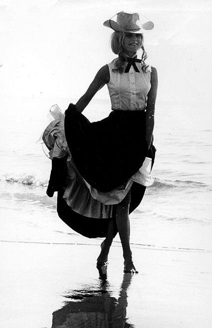 Brigitte Bardot in a cowboy hat and dress on a beach Photo Print (8 x 10)