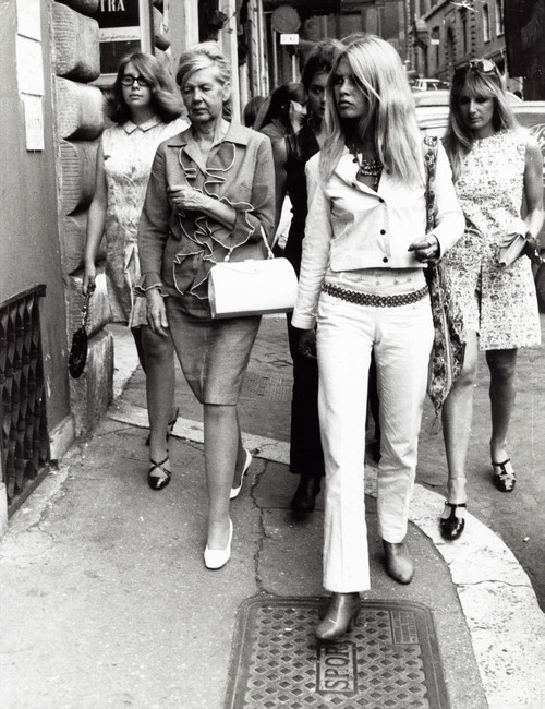 Brigitte Bardot on a sidewalk Photo Print (8 x 10)
