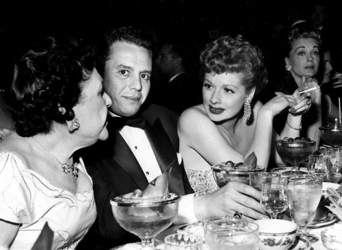 Lucille Ball talking at a table Photo Print - Item # VARGLP351444