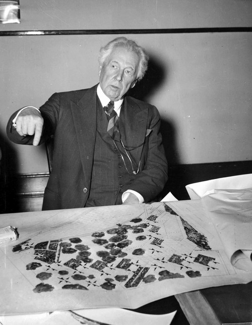 Frank Lloyd Wright by a blueprint Photo Print (8 x 10)