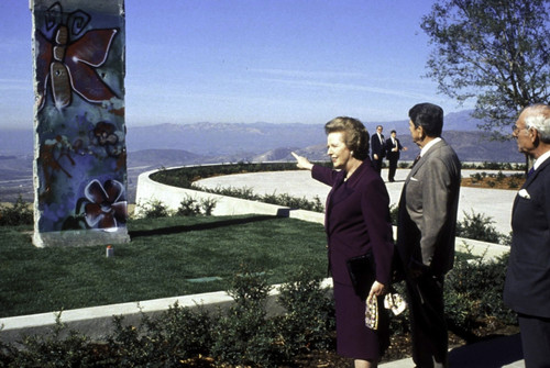 Ronald Reagan, Margaret Thatcher and Denis Thatcher being presented with a piece of the Berlin Wall Photo Print - Item # VARGLP367504