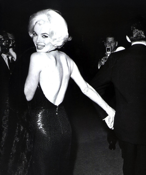 Marilyn Monroe looking over her shoulder wearing an evening dress Photo Print (8 x 10)