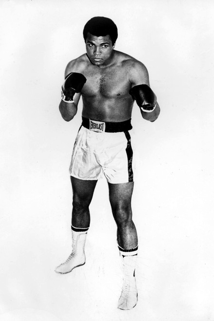 A Muhammad Ali wearing boxing gloves Photo Print - Item # VARGLP371327