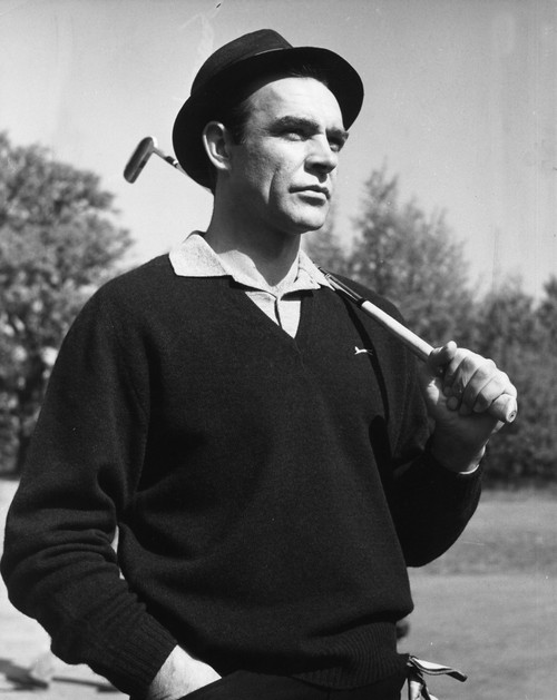 Film still of Sean Connery holding a golf club in Goldfinger Photo Print (8 x 10)