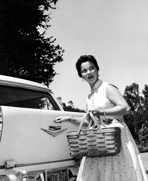 Shirley Temple holding a picnic basket Photo Print (8 x 10)