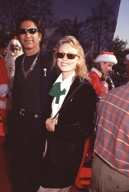 Faye Dunaway & Hook Herrera Wearing Sunglasses Santas In Background Photo Print