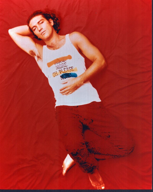 Antonio Banderas Laying In Red Pants Photo Print