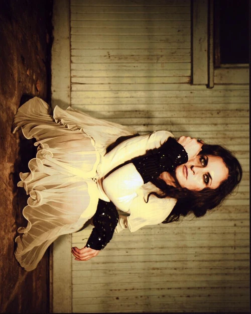 Rain Phoenix Sitting In Dress And Sequin Gloves Photo Print