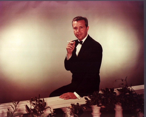 Dick Powell Leaning On Railing Smoking Cigarette Photo Print