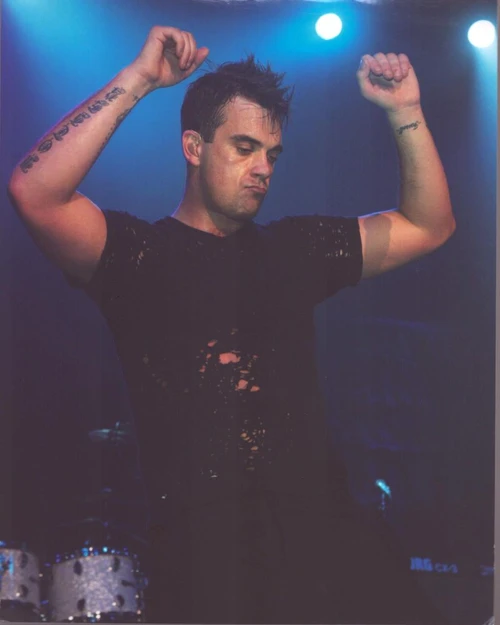 Robbie Williams On Stage In Ripped Shirt Arms Up Photo Print