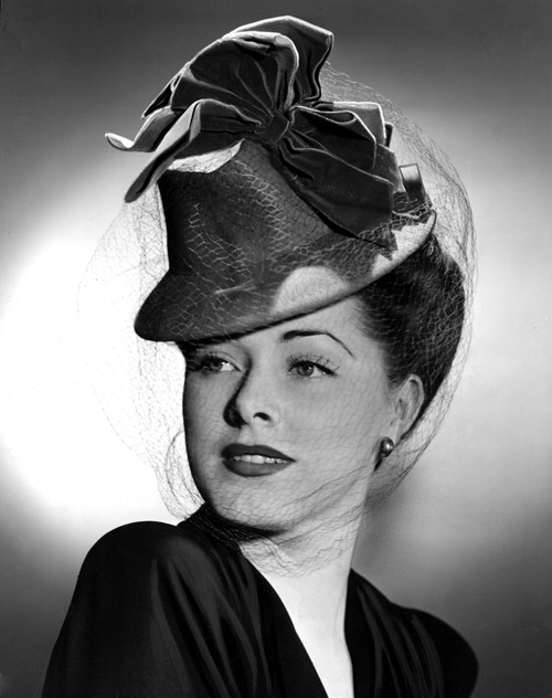 Eleanor Parker Wearing A Tall Crowned Chapeua Made Of Felt With Velvet Bows 1943. Photo Print - Item # VAREVCPBDELPAEC038H