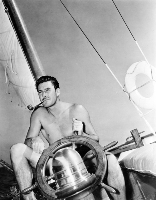 Errol Flynn Relaxing On His Yacht 10/20/37 Photo Print - Item # VAREVCPBDERFLEC010H