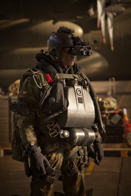 U.S. Navy Seal combat diver equipped with night vision, prepares
