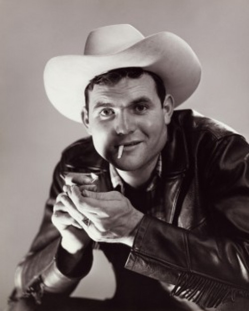 cowboy lighting a cigarette Portrait of a cowboy lighting a cigarette Poster Print - Item #  VARSAL25518687