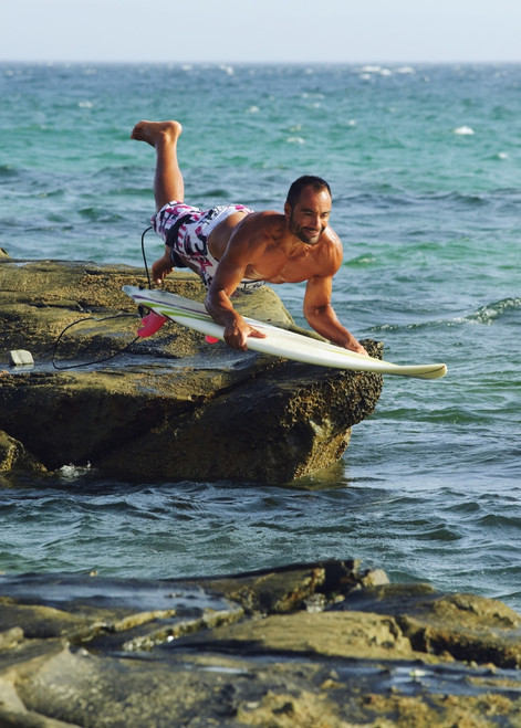 Man Jumping Into The Water On His Surf Board PosterPrint - Item