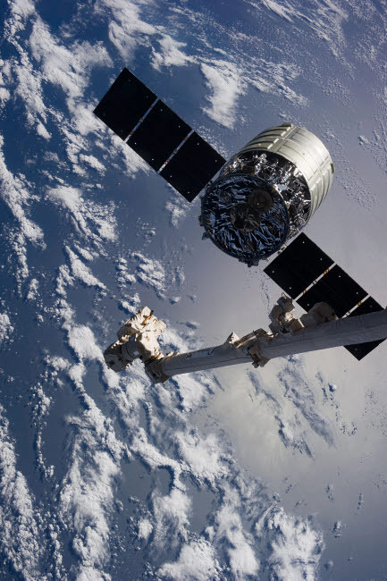 Canadarm2 robotic arm releases the Cygnus spacecraft Poster Print