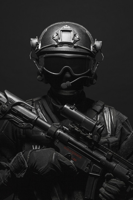 Spec ops police officer SWAT in black uniform and face mask