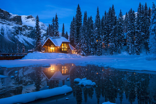 Emerald Lake Lodge on Emerald Lake backed by President range at night ...