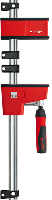 The best parallel clamp in the world just got better! How? By listening to you and building in features that provide the solutions you asked for. The new K BODY REVOlution (KRE) is designed to clamp at 90 degrees to the rail with very large clamping surfaces. The ergonomic two part handle includes a steel socket that allows one to apply clamping force using a hex key. While this helpful feature was designed for ease of clamping, it does allow one to provide more clamping force and is particularly helpful for those with wrist strength issues. The operating jaw has undergone some evolutionary changes as well. Position it where you want and start clamping. The easy set-up allows one to position the operating jaw where you want and, it will stay put during set up. The New BESSEY K BODY REVOlution offers a load limit of 2200 lbs, an everyday clamping force of 1700 lbs and sizes that range from 12 In. to 98 In.   BESSEY. Simply better.