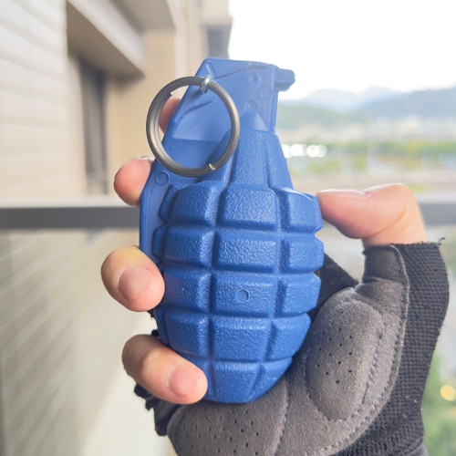 Safe tactical training grenade dummy with removable pin for martial arts and law enforcement exercises.