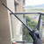 High-impact polymer tactical practice baton with textured grip for martial arts training."
