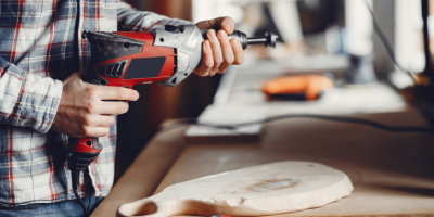 Worker with helmet and tools