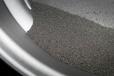 What is grit blasting and how does it work?