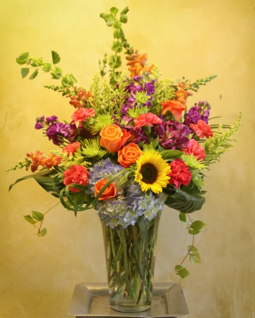 Hand-designed romantic flower arrangement from Main Floral with bold colorful blooms