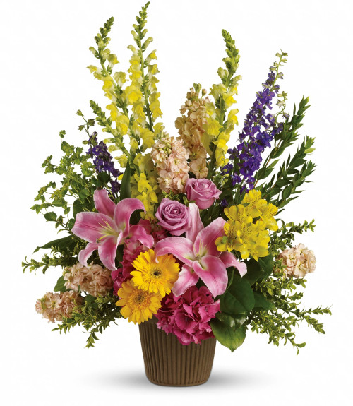 Glorious Grace is an elegant, designer’s choice arrangement that brings uplifting beauty and serene presence to any occasion. Crafted in a sleek urn-style container, it features a thoughtful composition of premium seasonal blooms, artfully arranged to offer balanced height and fullness. Offered in Regular, Deluxe, and Premium sizes, Glorious Grace makes a dignified statement—perfect for memorial ceremonies, sympathy settings, or as a meaningful centerpiece to honor cherished moments. Glorious Grace is an elegant, designer’s choice arrangement that brings uplifting beauty and serene presence to any occasion. Crafted in a sleek urn-style container, it features a thoughtful composition of premium seasonal blooms, artfully arranged to offer balanced height and fullness. Offered in Regular, Deluxe, and Premium sizes, Glorious Grace makes a dignified statement—perfect for memorial ceremonies, sympathy settings, or as a meaningful centerpiece to honor cherished moments.