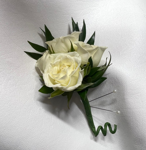 Main Floral Anoka presents a sophisticated spray rose boutonniere, expertly designed to complement her corsage.  Available in a variety of colors, this elegant accessory will be the perfect finishing touch for any prom, anniversary, or birthday celebration. As a premier florist serving Blaine MN, Andover MN, Coon Rapids MN, Anoka MN, Champlin MN, and the entire Twin Cities Area, Main Floral Anoka ensures that your special occasion is elevated by their exquisite floral creations.
With same-day delivery available, you can trust Main Floral Anoka to deliver your stunning spray rose boutonniere promptly, ensuring that it arrives in perfect condition for your event. Whether you're attending prom or celebrating an anniversary or birthday, the expertly crafted boutonniere will add an extra touch of sophistication and style.
Choose Main Floral Anoka for your spray rose boutonniere needs and experience the impeccable quality and service that has made them a trusted name in Blaine MN, Andover MN, Coon Rapids MN, Anoka MN, Champlin MN, and the entire Twin Cities Area.  With their commitment to excellence and convenient same-day delivery, your special occasion will be one to remember.