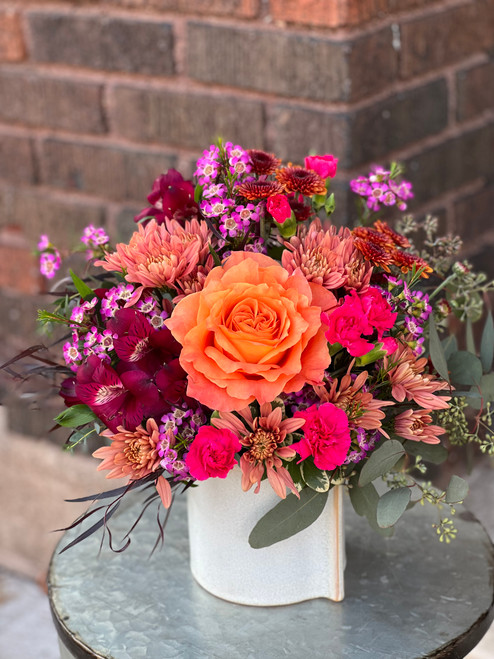 Just like Brook; just how it sounds! A collection of beutiful peach and burgandy followed by surprising pops of pink and orange... Just Like Brook! Spunky and cute, this arrangment is perfect for any celebration or any surprise.