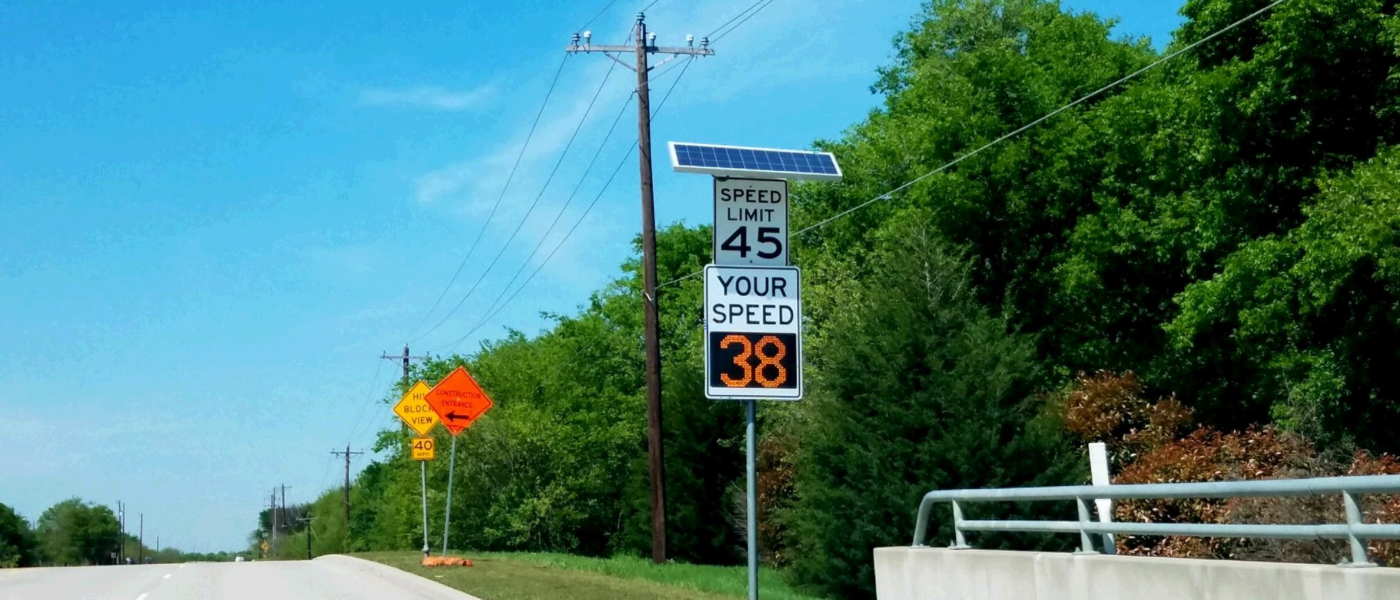 Speed limit sign with lighted speed detection display.