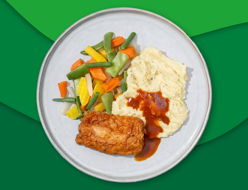 Gebakken lekkerbek met jus, puree en gemengde groenten