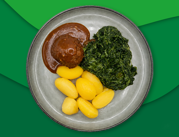 Rundergehaktbal met mosterdjus, aardappelen en spinazie à la crème