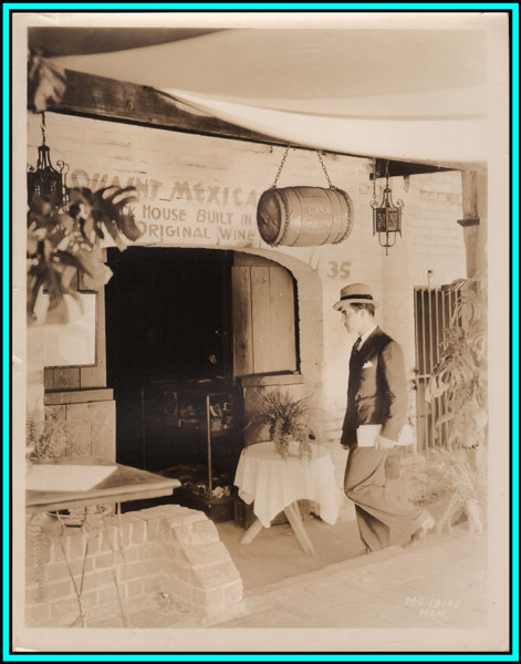 RAMON NOVARO Walking into a Shop - Original Vintage Photograph - 1930