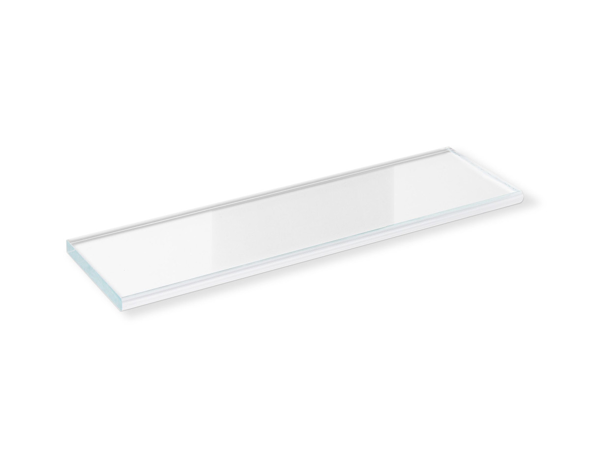 New Glass Shelf
Made of 3/8 in. fully tempered, clear safety glass, this shelf is made for integration into prefabricated wedi Niches with 12 in. wide openings. Front finish is pencil polished. The glass shelf may be inserted between and rest on tiles applied to the niche’s interior sides and back wall. Clear silicone or grout color matching expansion joint material (sealant/ caulk)should be used in joints between glass shelf and tile. It is recommended to protect the glass with tape to avoid these materials getting on glass surfaces that will later be visible.