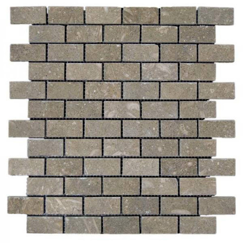 Portland Direct Tile & Marble Verde Rustico Honed 1x2 Mosaic 12x12 Mesh Limestone Mosaic, showcasing rectangular limestone mosaic tiles arranged on a mesh backing in a natural beige and greenish hue.