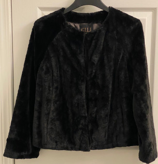 Waist length faux fur jacket. (Closed)
