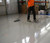 Floor coating being applied in warehouse