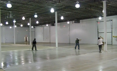 Warehouse with a glossy primer applied to the concrete floor.