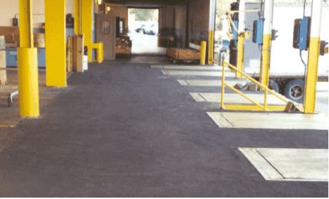 An warehouse loading deck with a an anti-slip safety coating applied to the concrete floor.