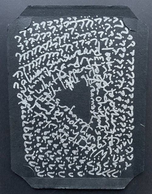 original word art with silver ink on vintage black recycled cardboard photo holder, with many question marks and some illegible words, forming a heart off-center in the center
